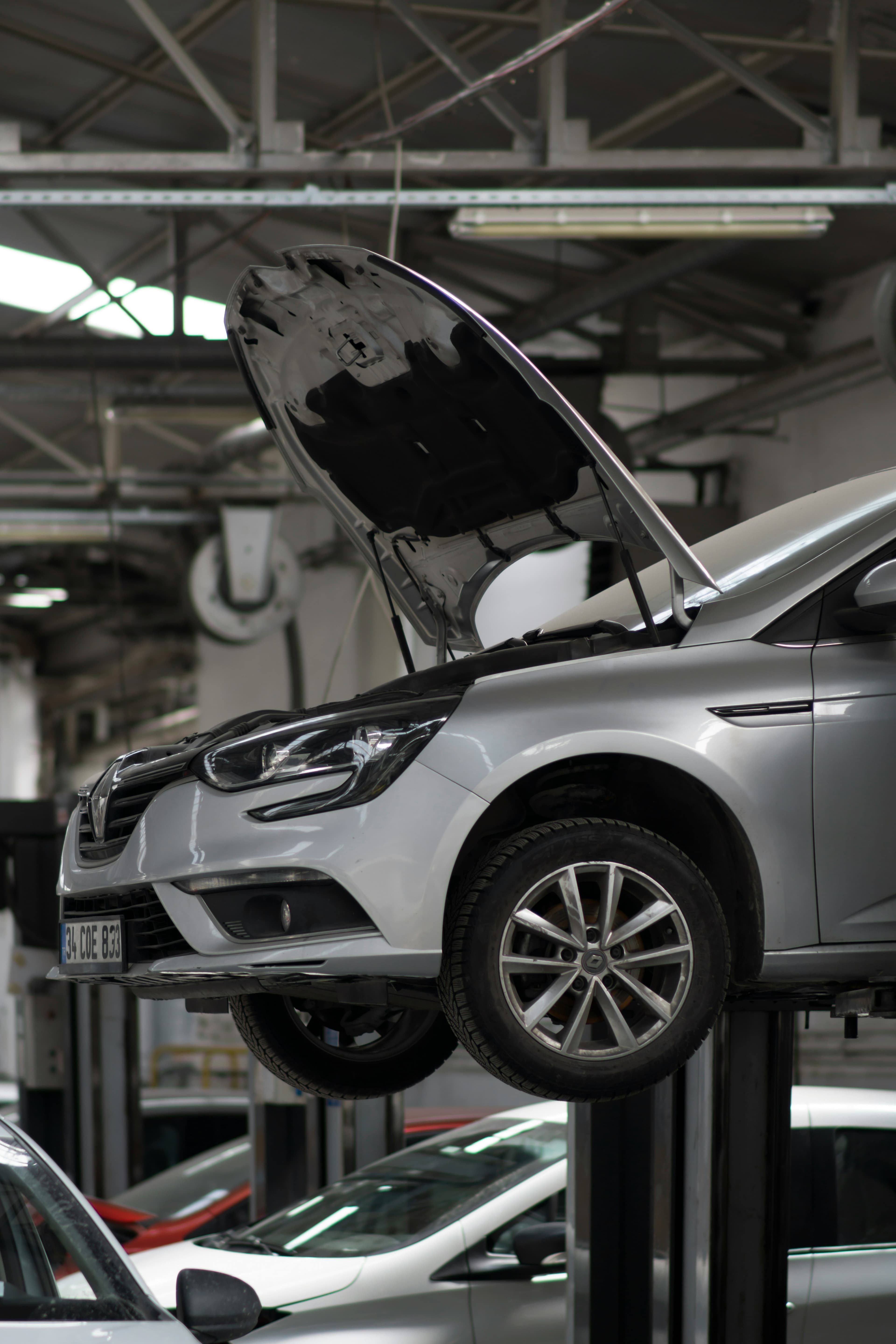Car on lift in auto garage